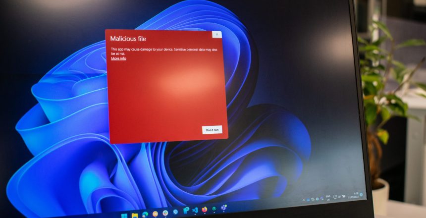 a malware warning popup on a laptop screen